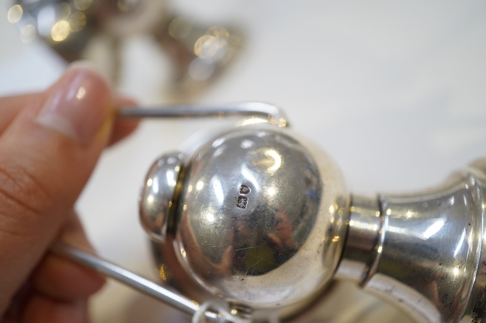 An Edwardian novelty cigar cutter and perpetual lighter, modelled as a pair of railway lamps, by Walker & Hall